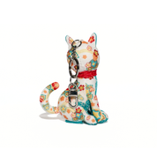 Colorful cat-shaped keychain with floral patterns on a white background