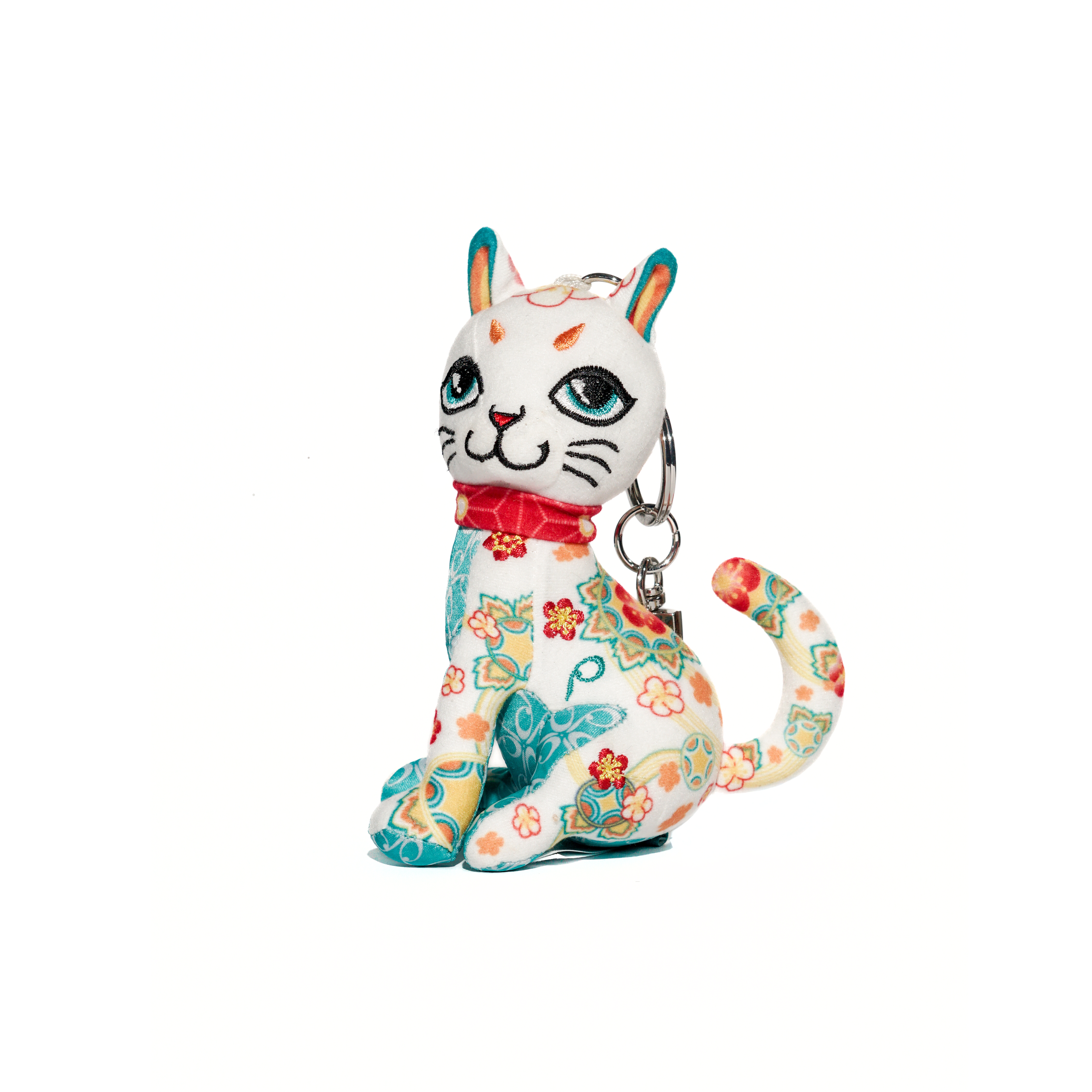 Colorful cat-shaped keychain with floral patterns on a white background