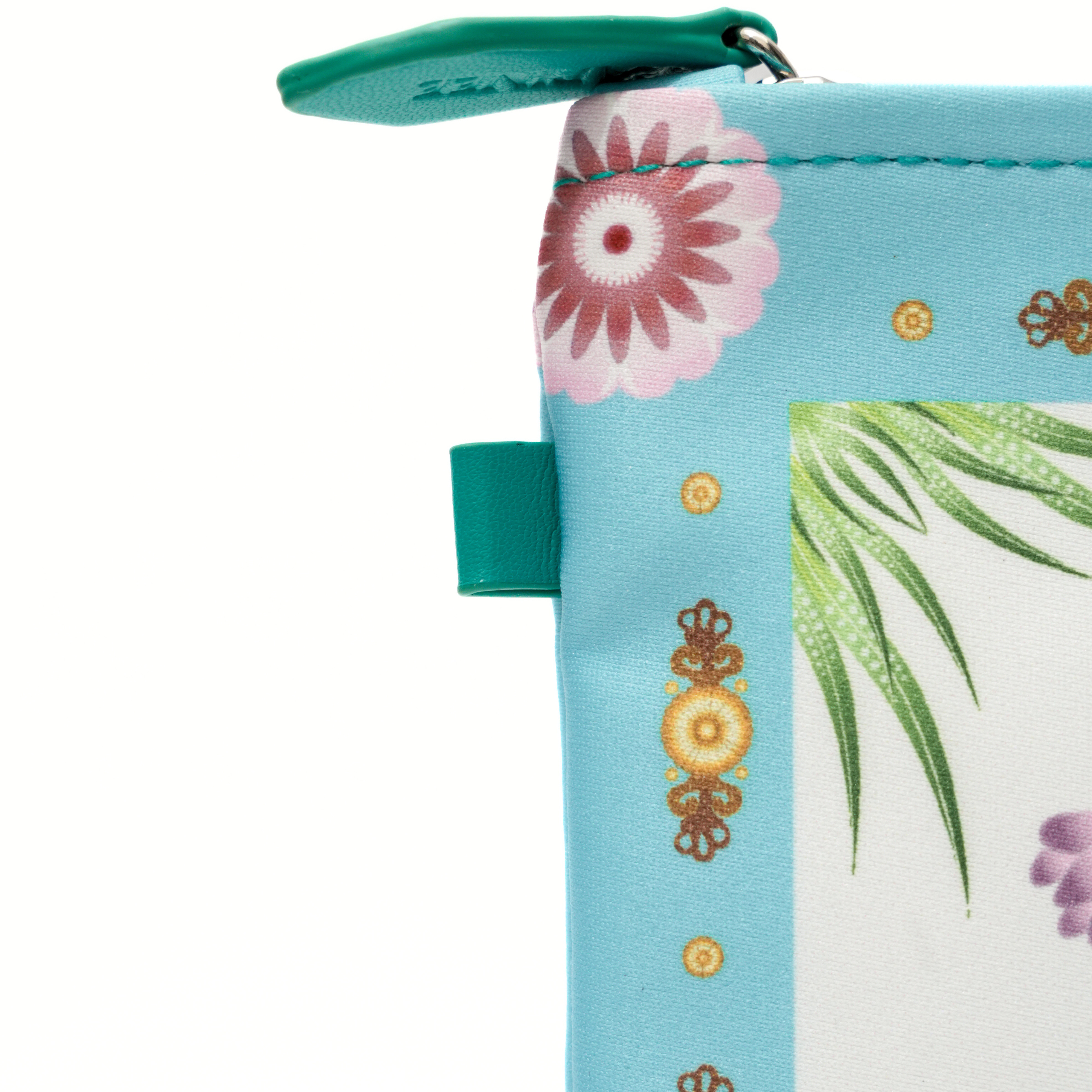 Close-up of a floral and leaf patterned pouch with a teal zipper.