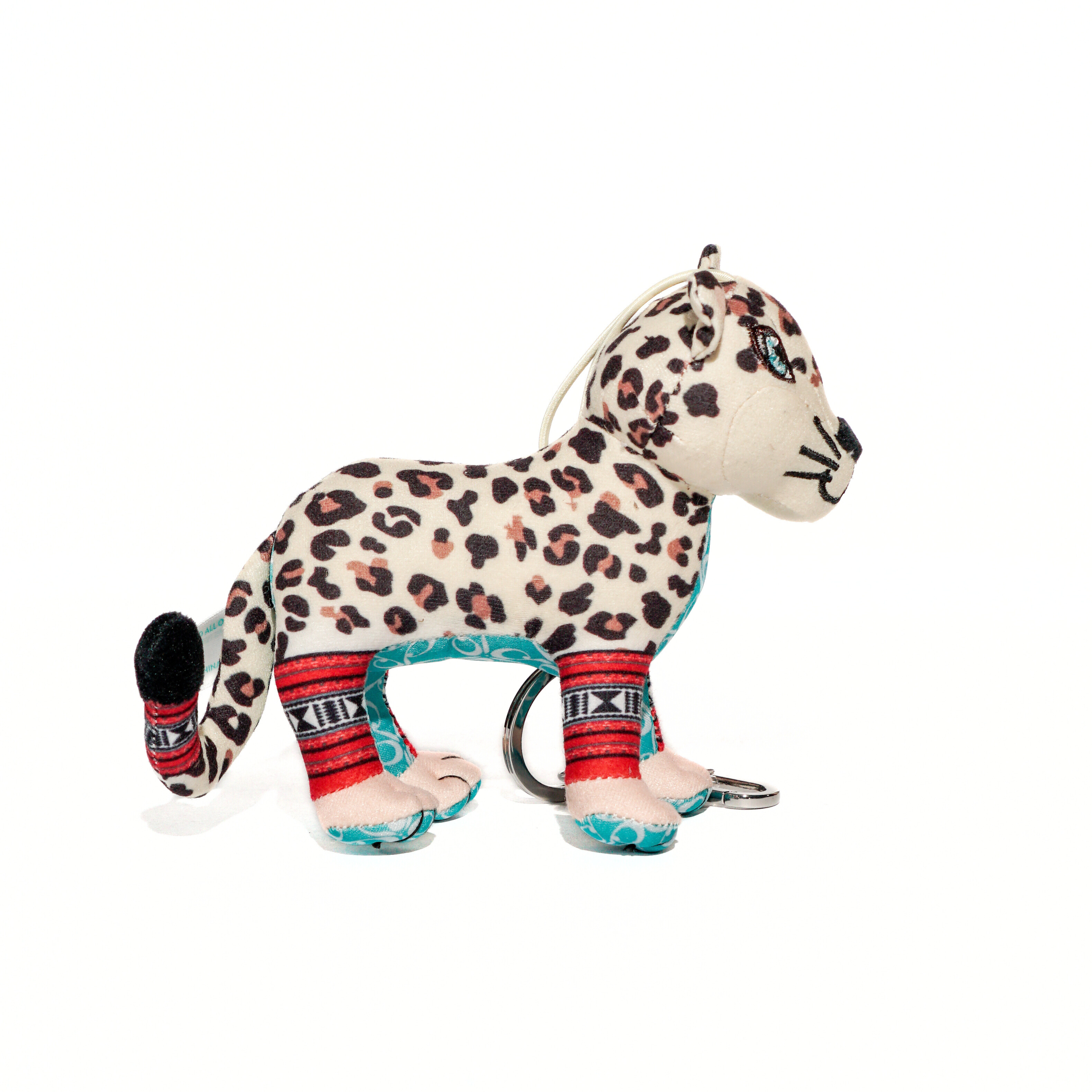 Leopard-patterned plush toy with colorful accents on a white background