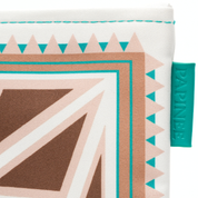 Close-up of a fabric with geometric pattern and a brand tag on a white background