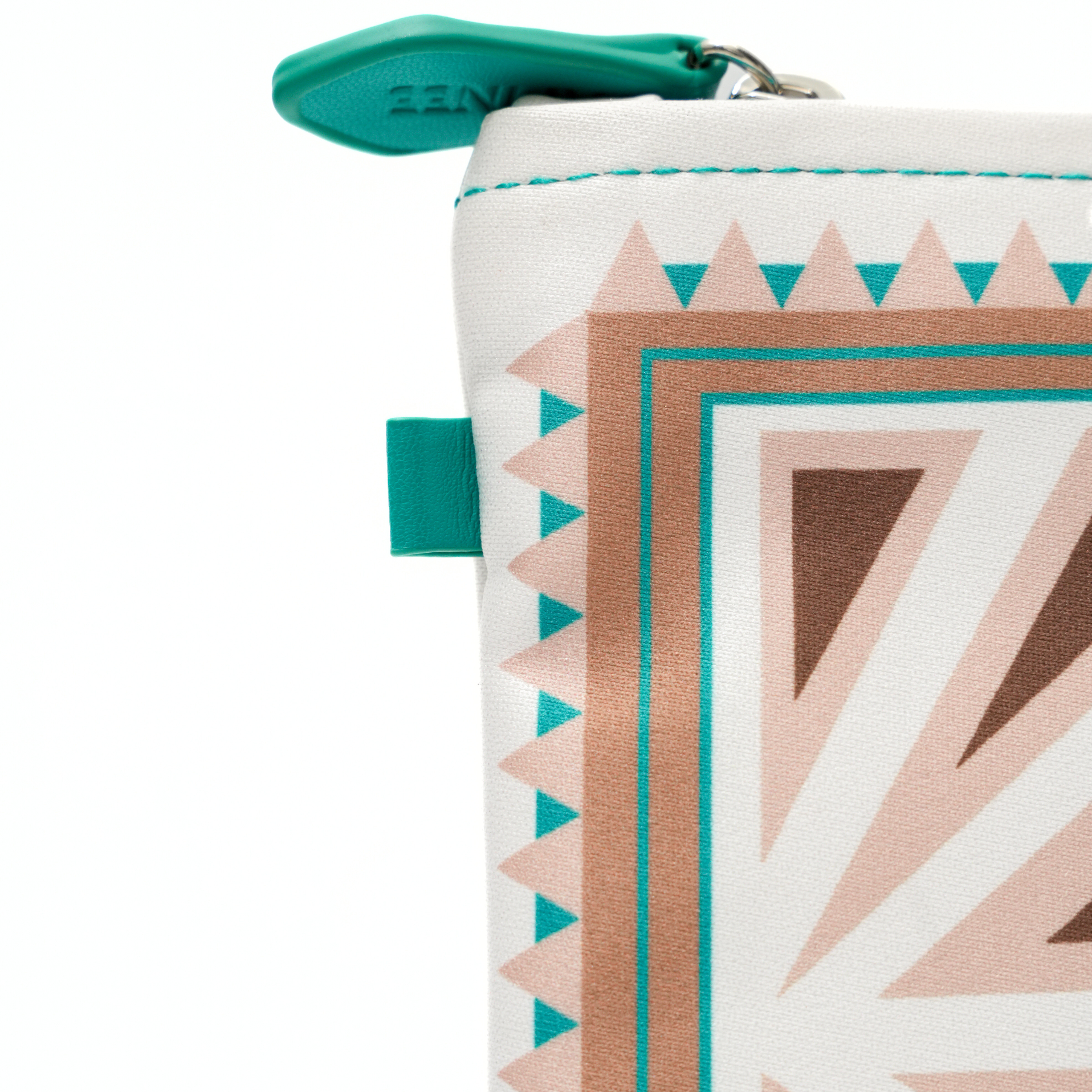 Close-up of a geometric patterned pouch with teal accents on a white background
