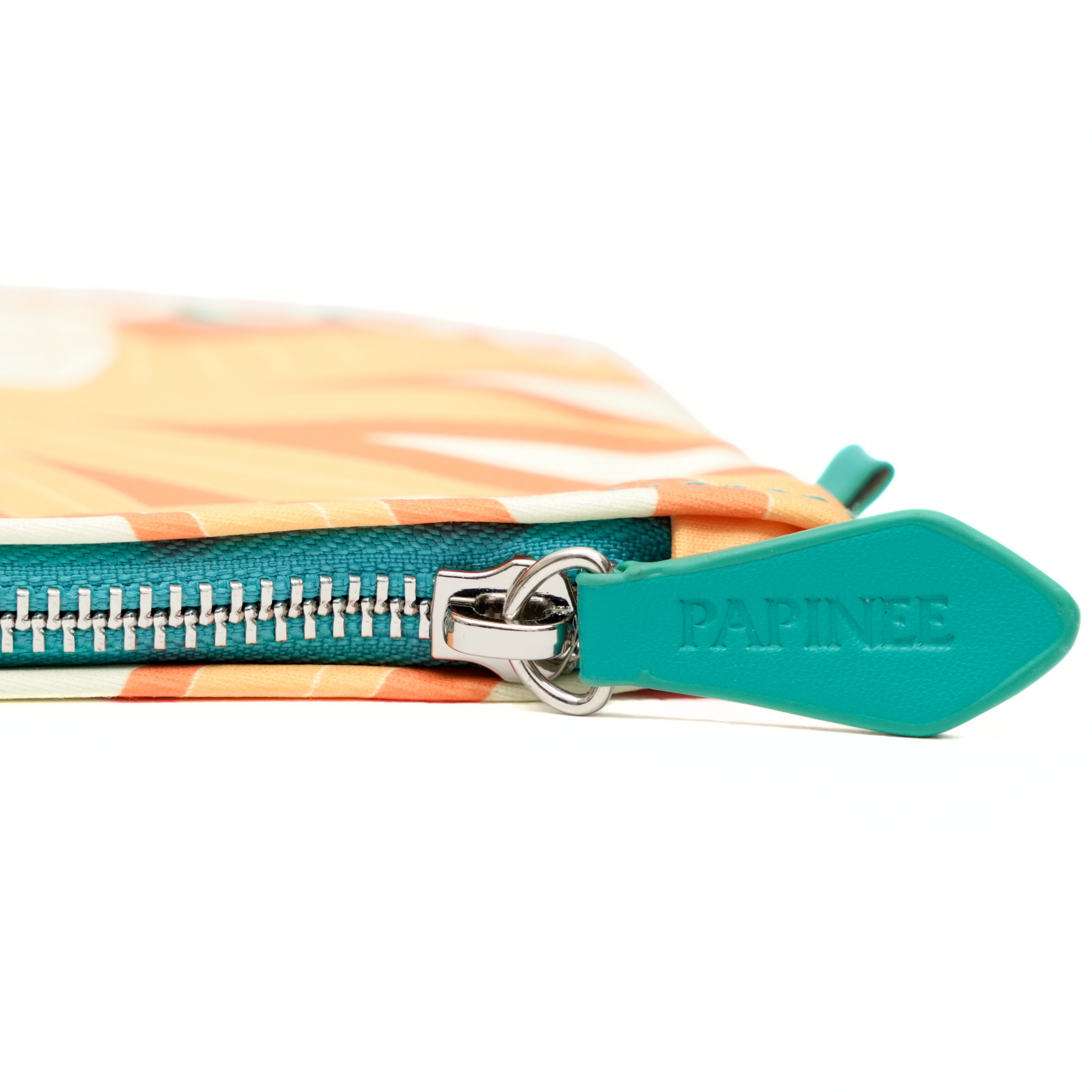 Colorful pouch with a teal zipper and 'PAPINEE' branding on a white background