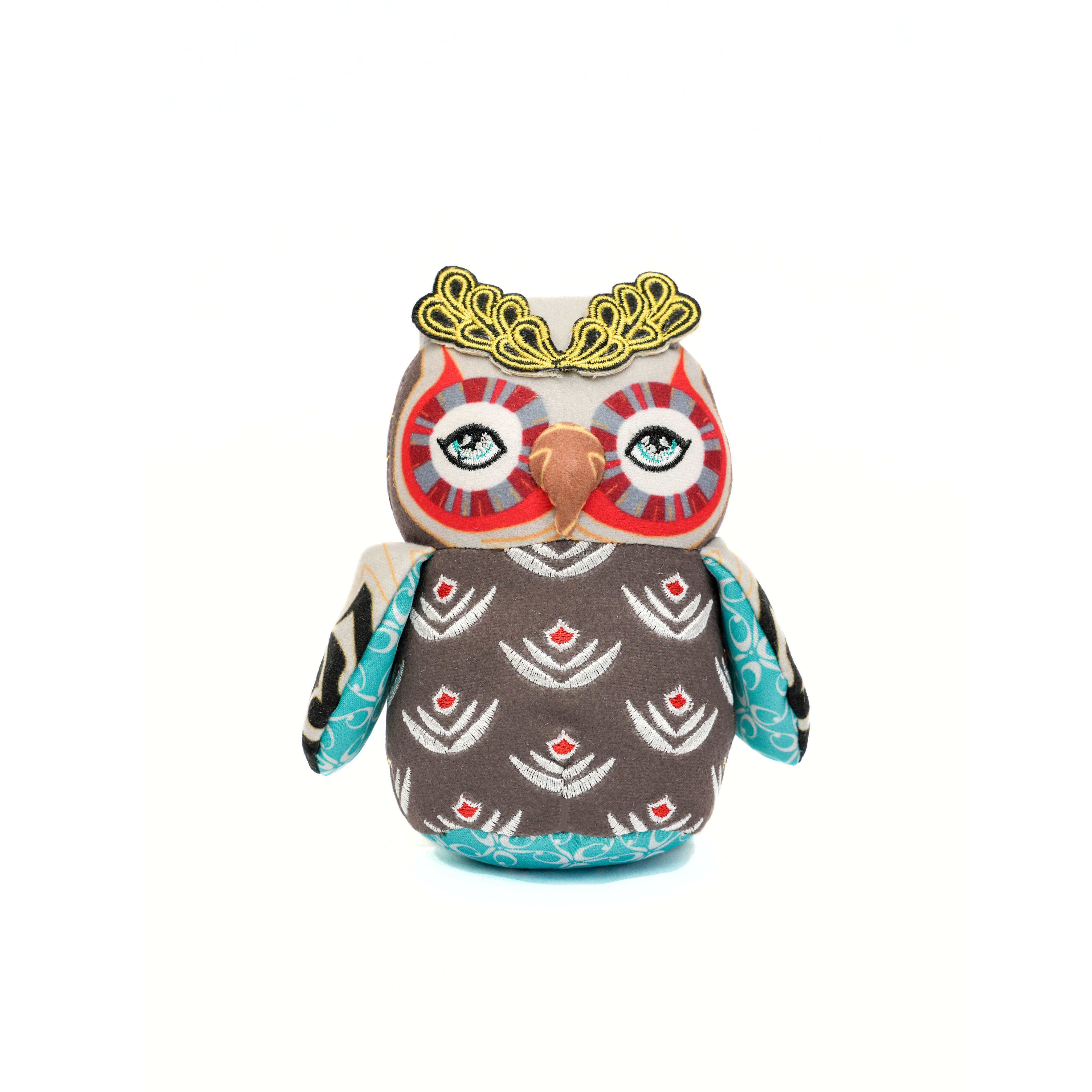 Plush owl toy with a decorative crown on a white background