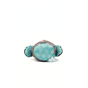 Toy turtle with turquoise pattern on a white background