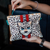 Leopard print pouch with a leopard design held by a person