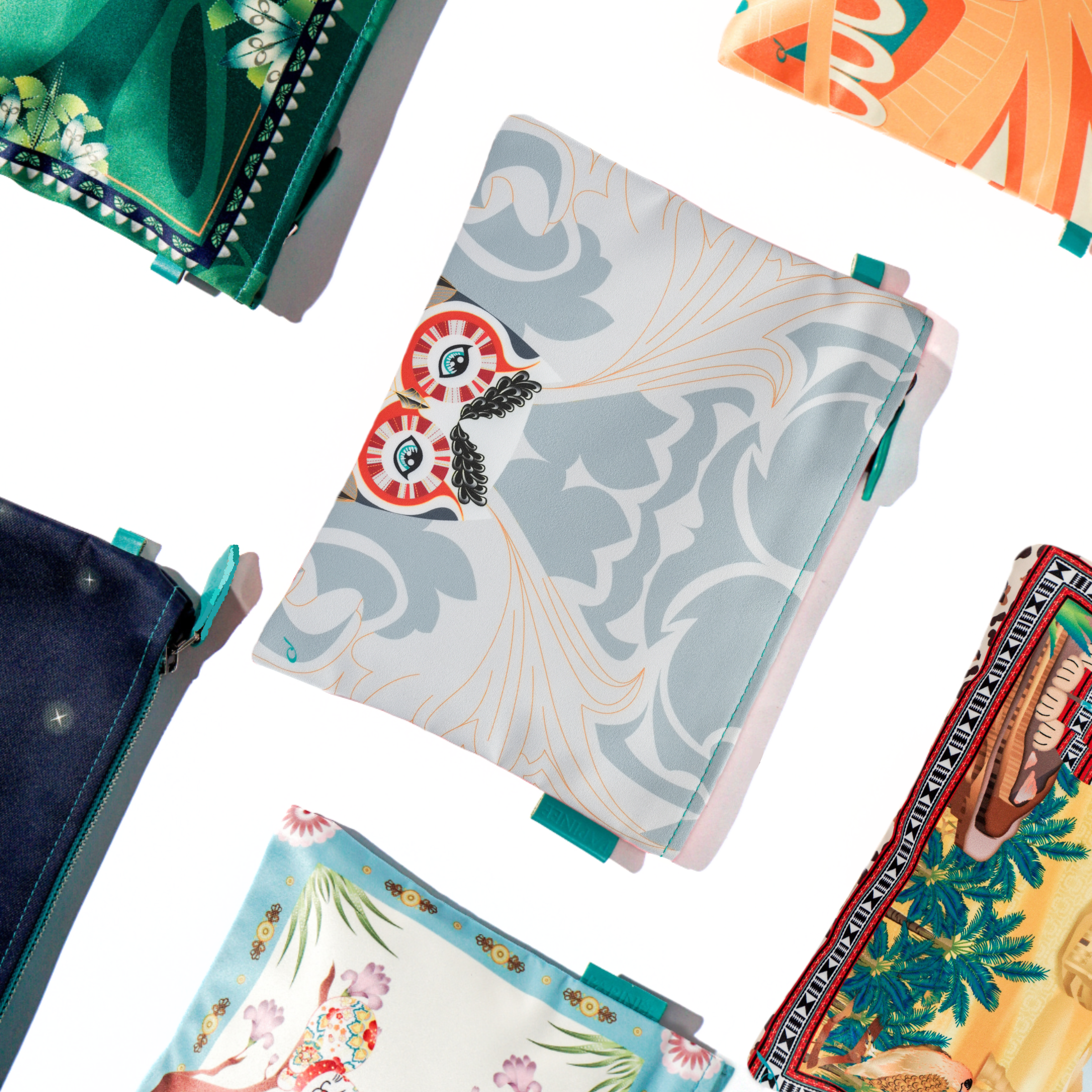 Collection of pouch with floral and abstract designs on a white background