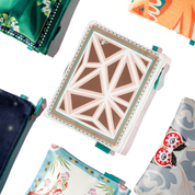 Collection of pouch with floral and abstract designs on a white background