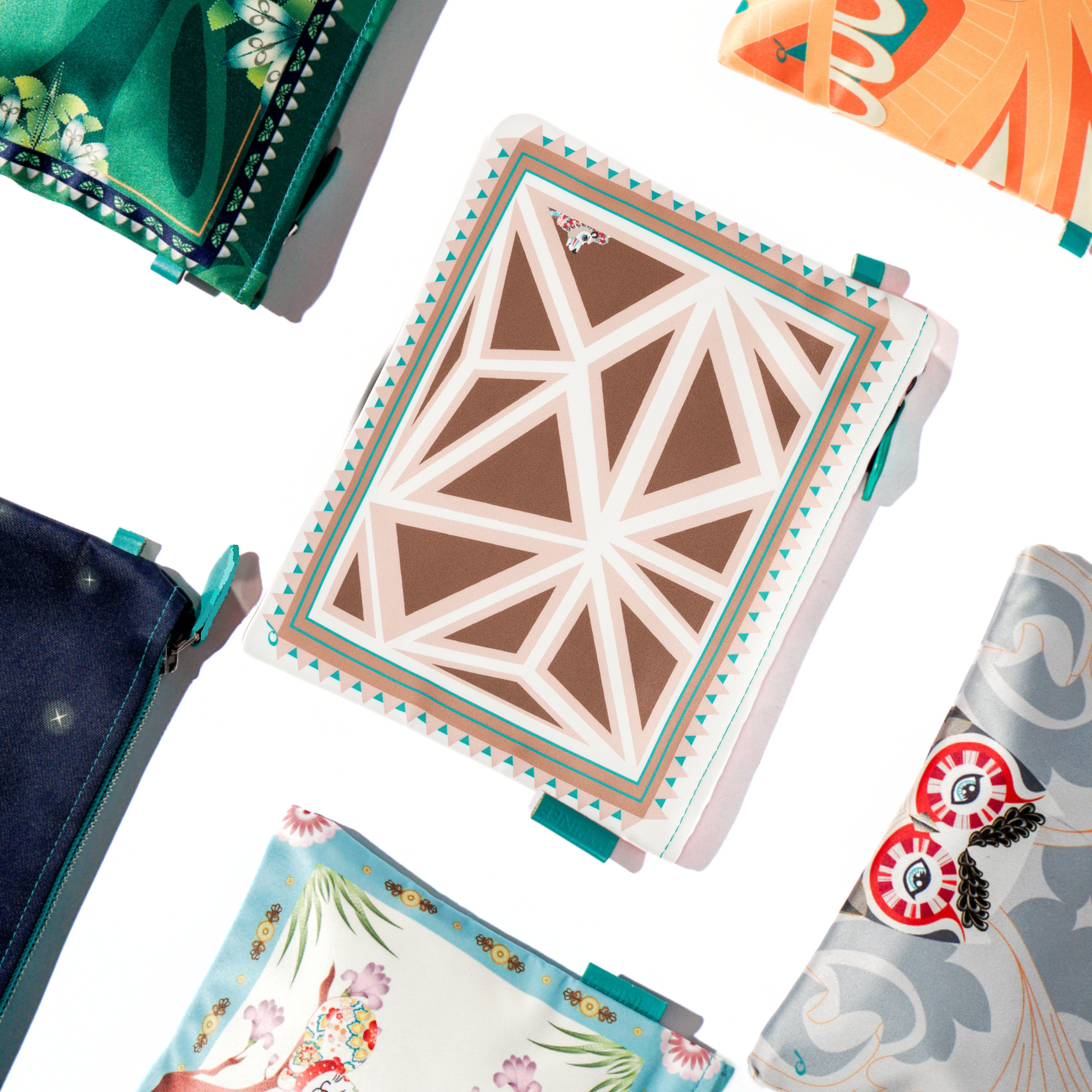 Collection of pouch with floral and abstract designs on a white background