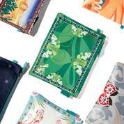 Collection of pouch with floral and abstract designs on a white background