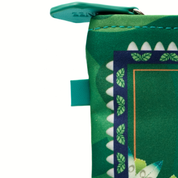 Green fabric with shark tooth pattern and zipper on a white background